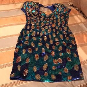 Sequined multi color evening wear. Bright blues greens golds bronze colors.